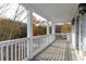 Outdoor porch features white railing and decorative lighting with views of autumn trees at 147 Bowen Sw Cir, Atlanta, GA 30315