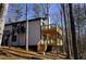 Modern home with two-tiered deck and wooded views at 6076 Belle Meade Dr, Villa Rica, GA 30180