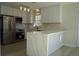 Modern kitchen with an island and white cabinets at 6076 Belle Meade Dr, Villa Rica, GA 30180