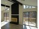 Open living space with a stone fireplace and large windows at 6076 Belle Meade Dr, Villa Rica, GA 30180