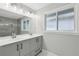 Modern bathroom with double vanity and marble tile at 2592 Baker Nw Rd, Atlanta, GA 30318