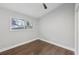 Light-filled bedroom featuring hardwood floors and a window at 2592 Baker Nw Rd, Atlanta, GA 30318