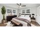 Bright bedroom with a king-size bed and large windows at 2592 Baker Nw Rd, Atlanta, GA 30318