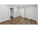 Spacious bedroom with hardwood floors and multiple entrances at 2592 Baker Nw Rd, Atlanta, GA 30318