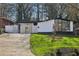 Ranch style home with modern exterior and landscaped lawn at 2592 Baker Nw Rd, Atlanta, GA 30318