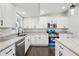 Updated kitchen featuring white cabinets and stainless steel appliances at 2592 Baker Nw Rd, Atlanta, GA 30318