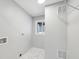 Clean laundry room with tile floor and shelving at 2592 Baker Nw Rd, Atlanta, GA 30318