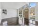 Bright living room with dark hardwood floors and large windows at 2592 Baker Nw Rd, Atlanta, GA 30318