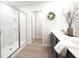 Elegant bathroom with dual sinks, a glass shower, and decorative accents at 257 Whitetail Cir, Canton, GA 30115