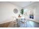 Cozy dining area featuring a round table, four chairs, natural light, and access to the patio at 257 Whitetail Cir, Canton, GA 30115