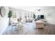 Bright and spacious living room with lots of windows, ceiling fan, and an adjacent eating area at 257 Whitetail Cir, Canton, GA 30115