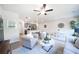 Bright open living room and kitchen featuring modern decor, wood floors, and neutral color scheme at 257 Whitetail Cir, Canton, GA 30115