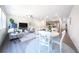 Open-concept living room with lots of seating and a modern kitchen in the background at 257 Whitetail Cir, Canton, GA 30115