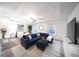 Spacious living room area featuring a comfortable blue sofa and stylish decor at 257 Whitetail Cir, Canton, GA 30115