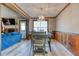 Open concept dining room with wood accents and view of living room at 4541 Old Highway 138 Sw, Loganville, GA 30052