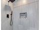 A luxurious walk-in shower boasts pebble-lined shelving and modern fixtures at 4541 Old Highway 138 Sw, Loganville, GA 30052