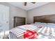 Bedroom with carpet flooring, a dresser, ceiling fan, and a large window at 4541 Old Highway 138 Sw, Loganville, GA 30052