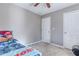 View of the bedroom, with two white doors and a ceiling fan/light fixture at 4541 Old Highway 138 Sw, Loganville, GA 30052