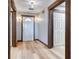 Hallway featuring wooden floors, white walls, and decorative wooden accents throughout the home at 4541 Old Highway 138 Sw, Loganville, GA 30052