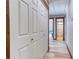 Hallway with closet doors and open doorways to bedrooms; hardwood style flooring at 4541 Old Highway 138 Sw, Loganville, GA 30052