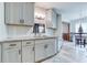 Stylish kitchen boasts granite counters, white subway tile backsplash, and updated light fixtures at 4541 Old Highway 138 Sw, Loganville, GA 30052