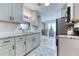 Modern kitchen features shaker cabinets, granite counters, a tile backsplash and stainless steel appliances at 4541 Old Highway 138 Sw, Loganville, GA 30052