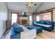 Inviting living room with brick fireplace, vaulted ceiling, and comfortable blue sofas at 4541 Old Highway 138 Sw, Loganville, GA 30052