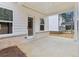 Covered porch with white columns, perfect for outdoor relaxing and entertaining with brick accents at 291 Martin Spring Rd, Lawrenceville, GA 30045