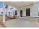 Covered porch with white columns, perfect for outdoor relaxing and entertaining with brick accents at 291 Martin Spring Rd, Lawrenceville, GA 30045