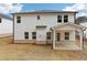 View of the backyard with a covered patio and white siding home at 291 Martin Spring Rd, Lawrenceville, GA 30045