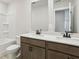 Bright bathroom with double sink vanity, modern fixtures, and a shower-tub combo at 291 Martin Spring Rd, Lawrenceville, GA 30045