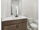 Well-lit bathroom featuring vanity with quartz countertops, modern fixtures, and shower at 291 Martin Spring Rd, Lawrenceville, GA 30045