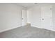 Spacious bedroom features neutral walls and plush carpeting, creating a comfortable and inviting space at 291 Martin Spring Rd, Lawrenceville, GA 30045
