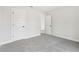Neutral bedroom features plush carpet and a door leading to another room at 291 Martin Spring Rd, Lawrenceville, GA 30045