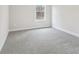 Cozy bedroom with natural light, neutral walls and plush carpeting, creating a comfortable space at 291 Martin Spring Rd, Lawrenceville, GA 30045