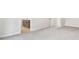 Bright bedroom with neutral walls, light carpet, and access to an ensuite bathroom at 291 Martin Spring Rd, Lawrenceville, GA 30045