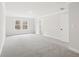 Spacious bedroom with neutral walls, carpeted floors, and natural light from a window at 291 Martin Spring Rd, Lawrenceville, GA 30045