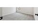 Cozy bedroom with neutral walls, plush carpeting, and natural light from a nearby window at 291 Martin Spring Rd, Lawrenceville, GA 30045