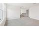 Bright and airy living area boasts natural light and plush carpeting at 291 Martin Spring Rd, Lawrenceville, GA 30045