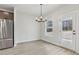 Bright and airy dining area with wood floors and stainless steel refrigerator at 291 Martin Spring Rd, Lawrenceville, GA 30045
