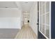 Inviting foyer featuring wood-look floors, white walls, and trim with a view into the living spaces at 291 Martin Spring Rd, Lawrenceville, GA 30045