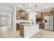 Modern kitchen featuring an island, stainless steel appliances, and stylish cabinetry at 291 Martin Spring Rd, Lawrenceville, GA 30045