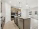 Modern kitchen featuring stainless steel appliances, granite countertops, and a center island at 291 Martin Spring Rd, Lawrenceville, GA 30045