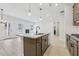 Bright kitchen features a large island, stainless appliances, and a cozy breakfast nook at 291 Martin Spring Rd, Lawrenceville, GA 30045