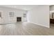 Cozy living room featuring wood-look floors, a fireplace, and large windows that provide natural light at 291 Martin Spring Rd, Lawrenceville, GA 30045