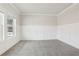Comfortable living room with carpet, trim and large windows at 291 Martin Spring Rd, Lawrenceville, GA 30045
