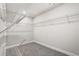 Spacious walk-in closet with ample shelving for organized storage at 291 Martin Spring Rd, Lawrenceville, GA 30045