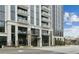 Modern condo building boasting a sleek facade, multiple balconies, and upscale architectural design at 2425 Peachtree Ne Rd # 1106, Atlanta, GA 30305