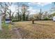 Sprawling backyard with mature trees and outbuildings at 1751 Nathan Ln, Austell, GA 30168