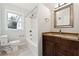 Bathroom featuring a vanity with stone countertop and shower/tub combo at 1751 Nathan Ln, Austell, GA 30168